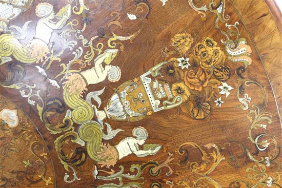 A Victorian walnut, crossbanded, sycamore, ivory, mother of pearl, brass, copper and pewter marquetry centre table, in the manner of R.